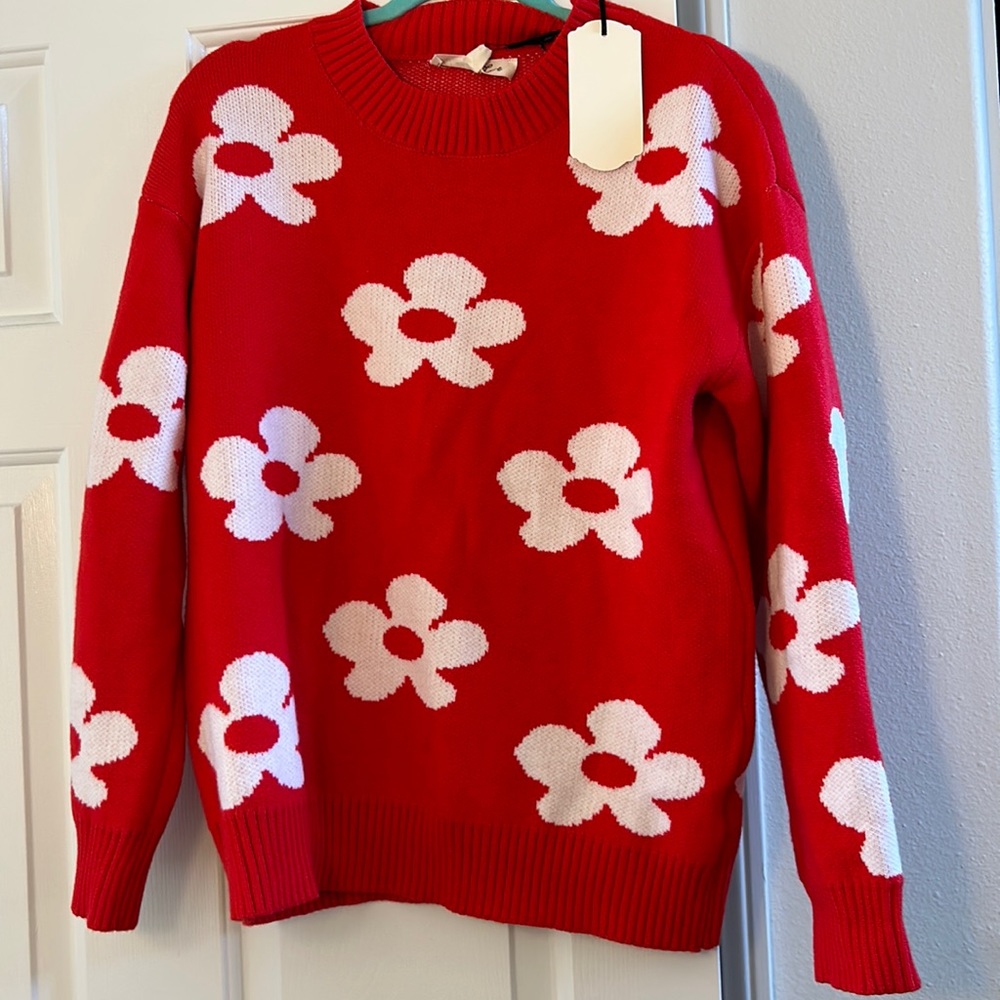 Red sweater white flowers